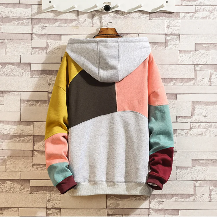 Relaxed fit men's patchwork hoodie, offering unique comfort & style. Perfect for modern casual or activewear.