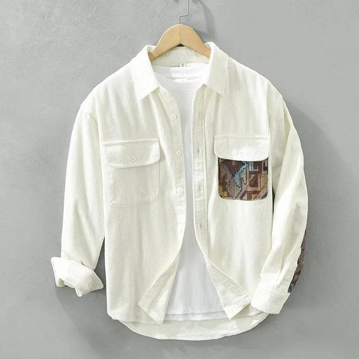 Casual men's long sleeve shirt with trendy patchwork detailing and chest pockets. Versatile cotton top.
