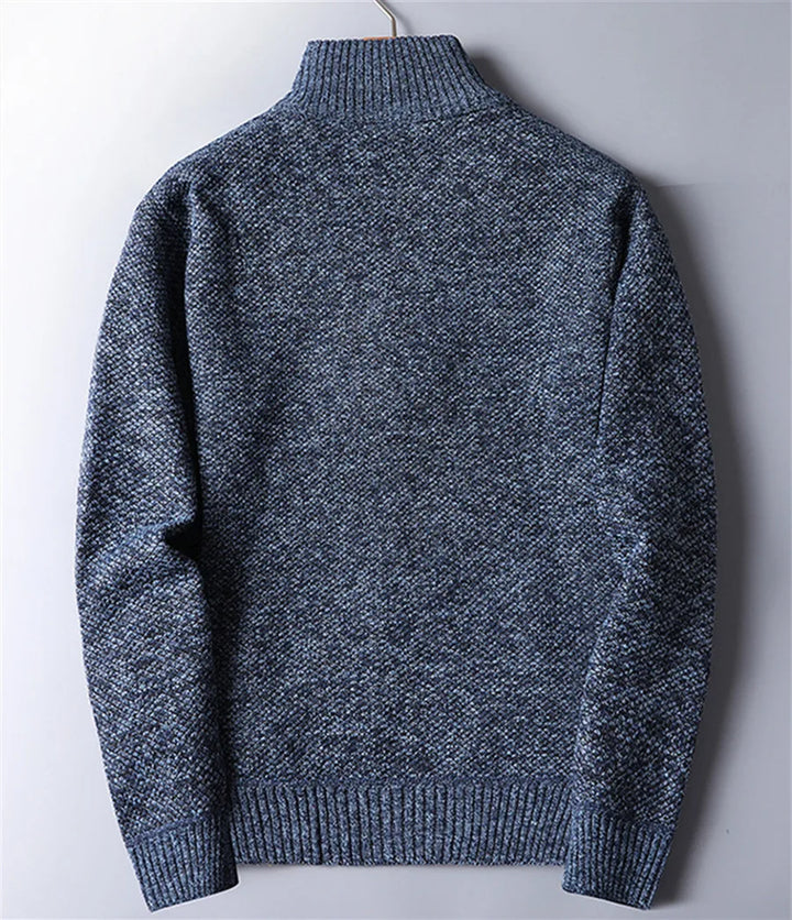 Modern men's quarter-zip turtleneck pullover with textured knit, perfect for fall fashion layering.