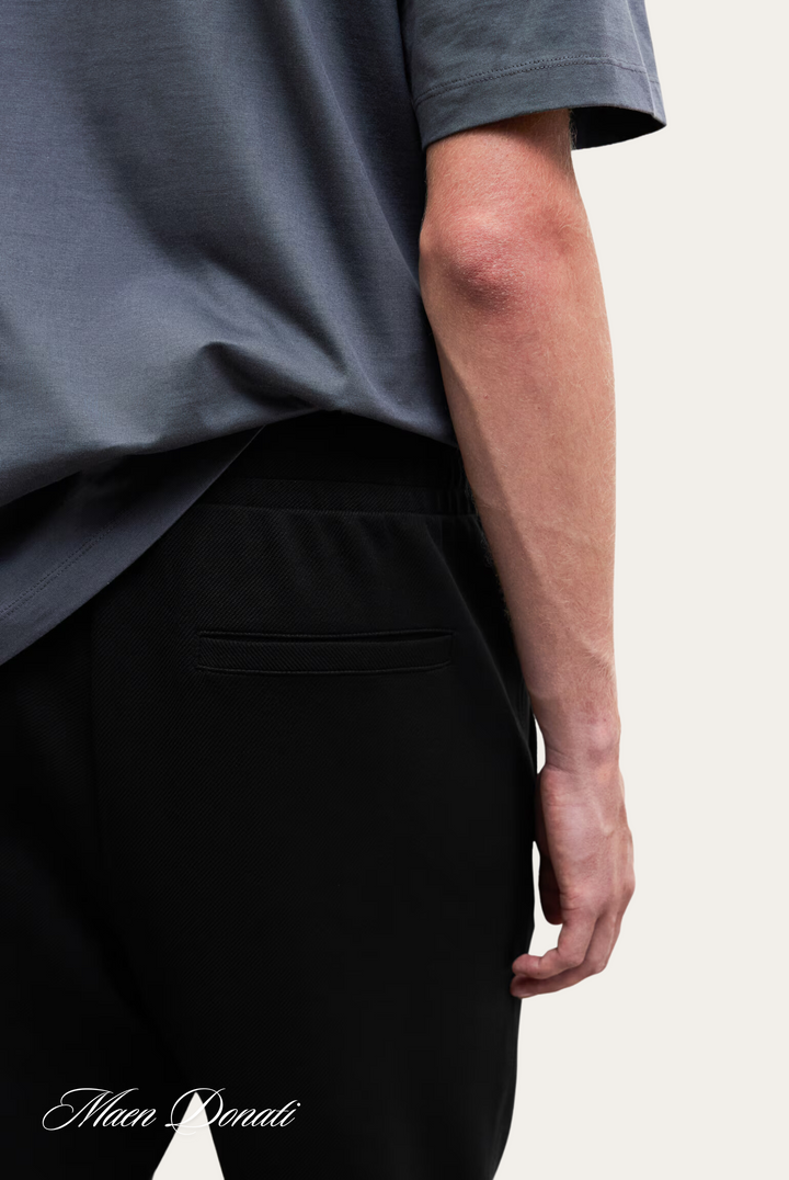 Men's casual relaxed-fit trousers, stylish and sustainable with recycled material.