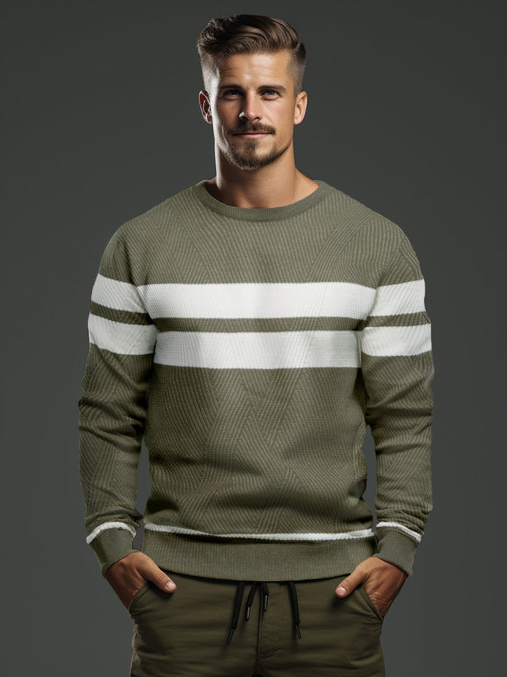 Man models a modern striped crewneck sweater, showcasing comfortable men's fashion & style.