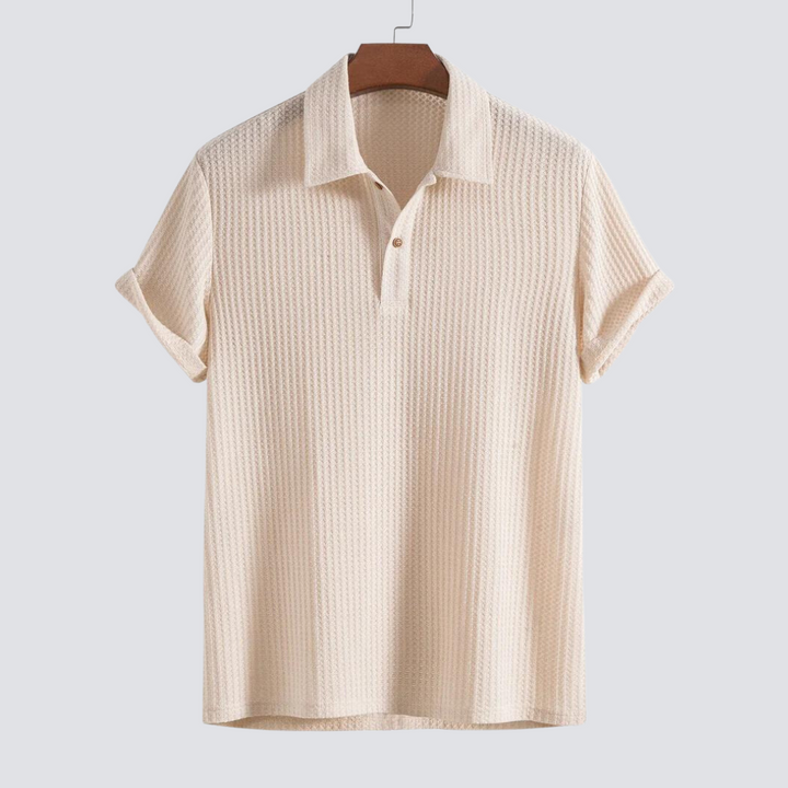 Men's stylish textured polo shirt. Modern short-sleeve top for versatile everyday wear.