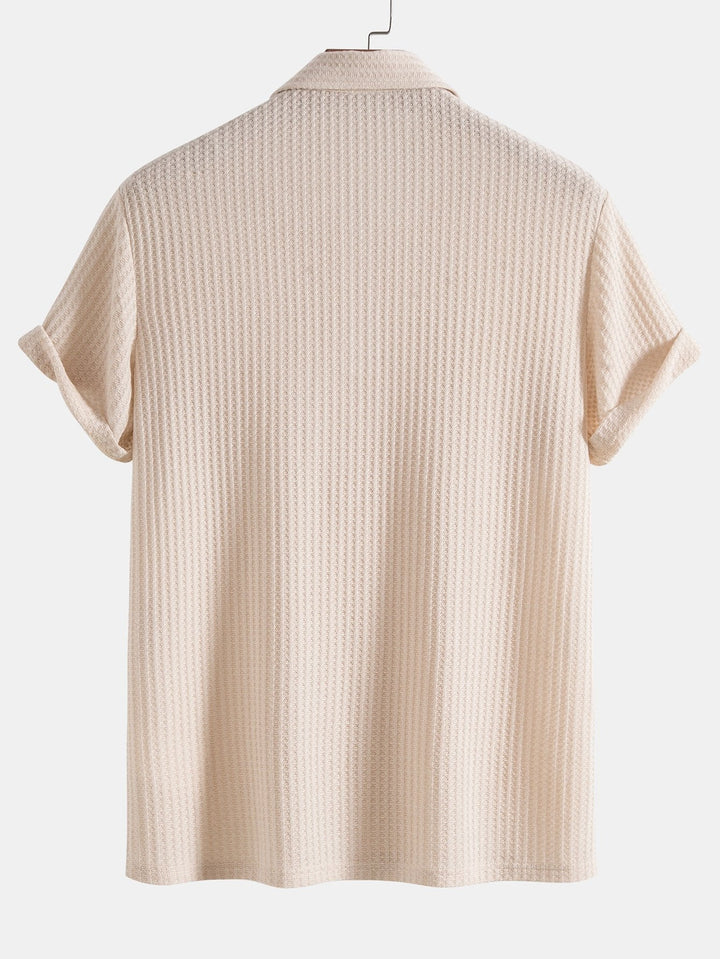 Men's classic textured polo shirt with short sleeves, buttons, and collar for a modern look.
