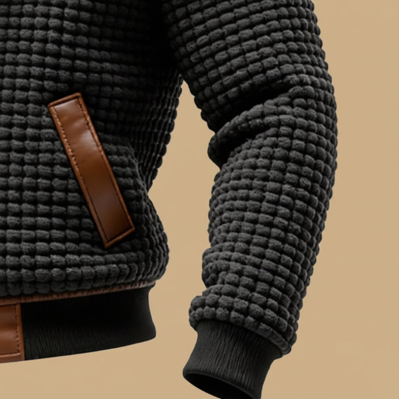 Man wearing a rugged textured winter jacket, keeping warm & stylish during outdoor activities in winter.
