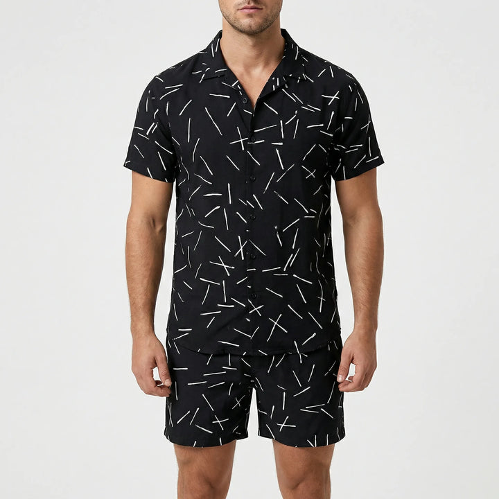 Model wearing the men's casual two-piece summer set with bold print, ready for a stylish vacation.