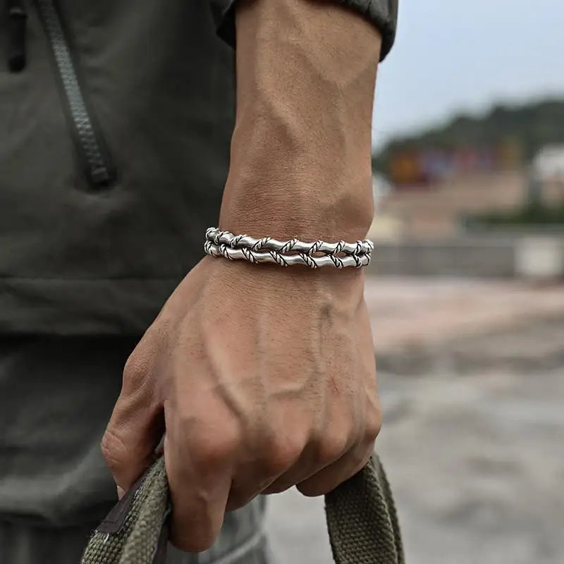 Elegant men's stainless steel bracelet with a finely crafted wooden inlay. Modern jewelry for men.