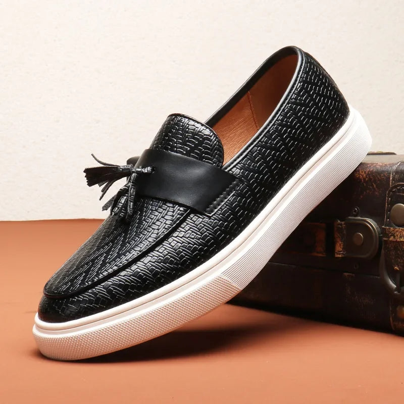 Black men's woven tassel loafers. Sleek slip-on dress shoes, ideal for sophisticated style and all-day comfort.