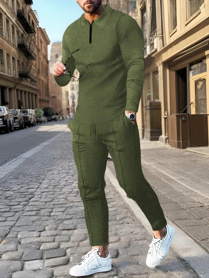 Soft cotton blend men's lounge set with stylish zip neck. Modern two-piece for casual comfort and men's fashion.