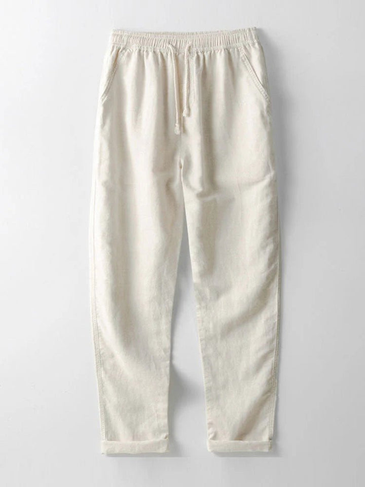 Men's summer outfit set featuring a casual shirt and pants with stylish rolled cuffs. Relaxed fit for ease.
