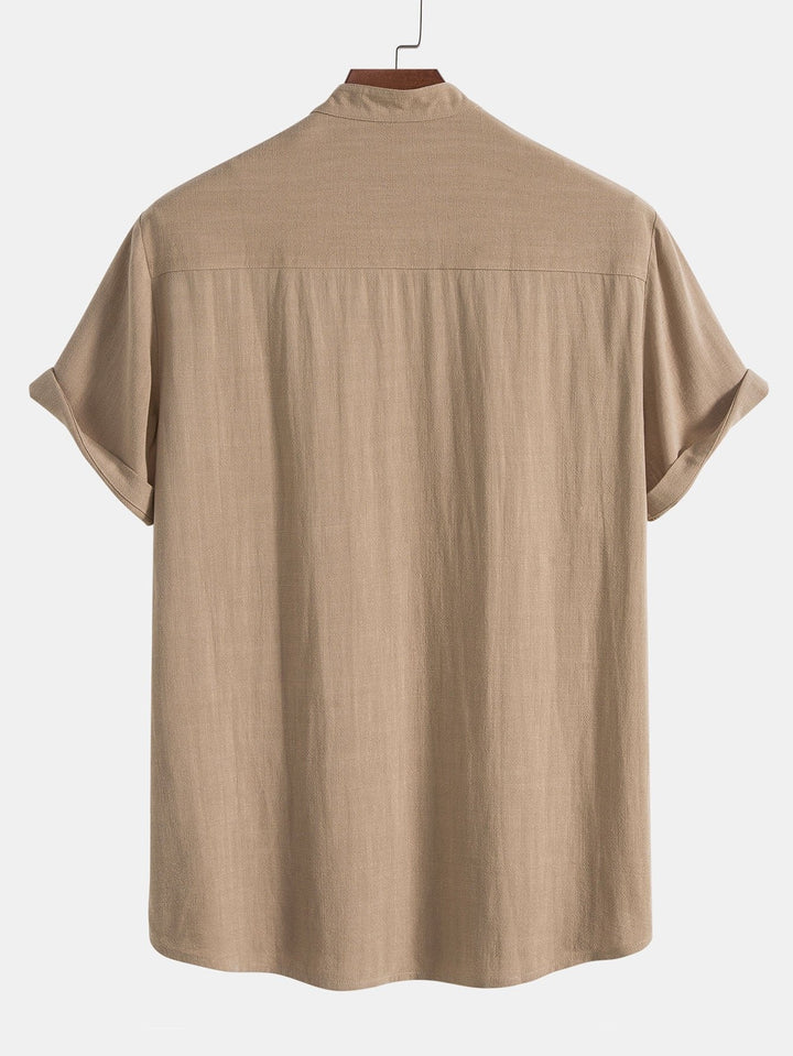 Lightweight men's summer shirt and pants set. Casual two-piece with rolled cuffs, great for warm weather fashion.