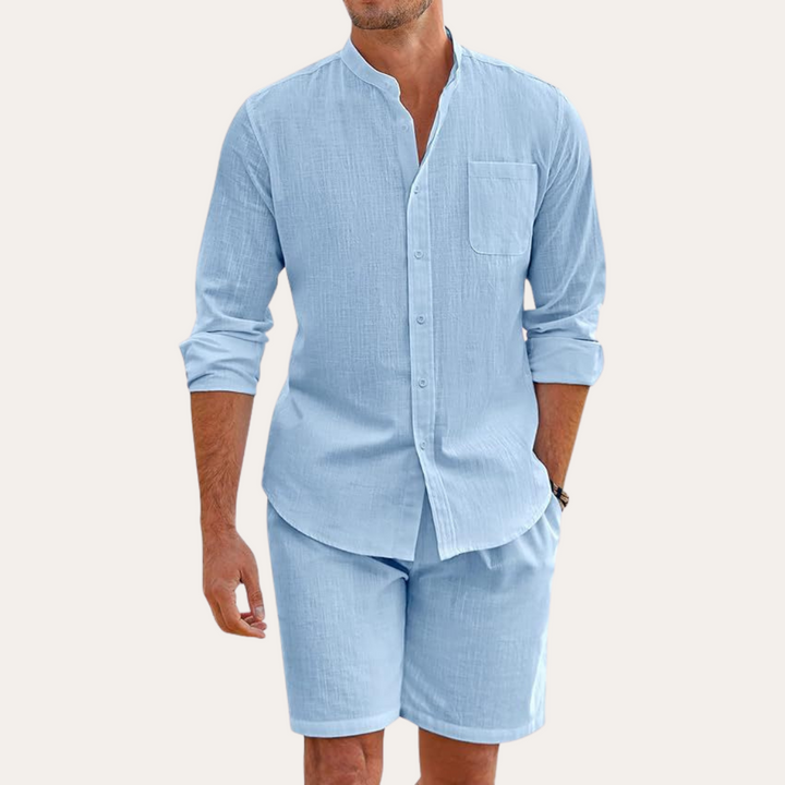 Comfortable men's casual two-piece set for summer. Long sleeve shirt & shorts, ideal for beach attire & relaxed wear.