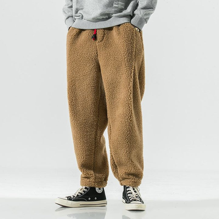 Cozy men's sherpa fleece joggers, ideal for winter comfort and relaxed lounging.