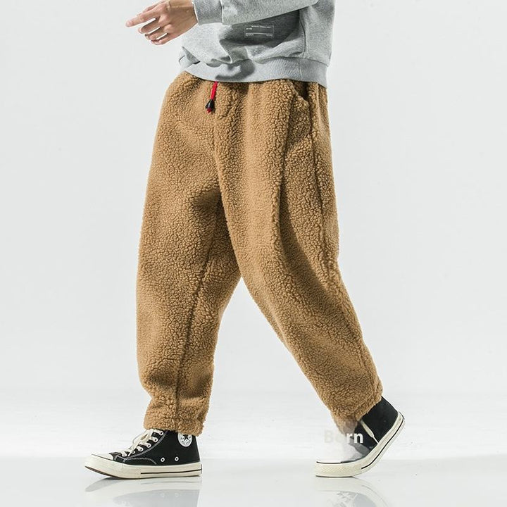 Relaxed fit men's joggers, soft sherpa fleece for casual wear and ultimate comfort.