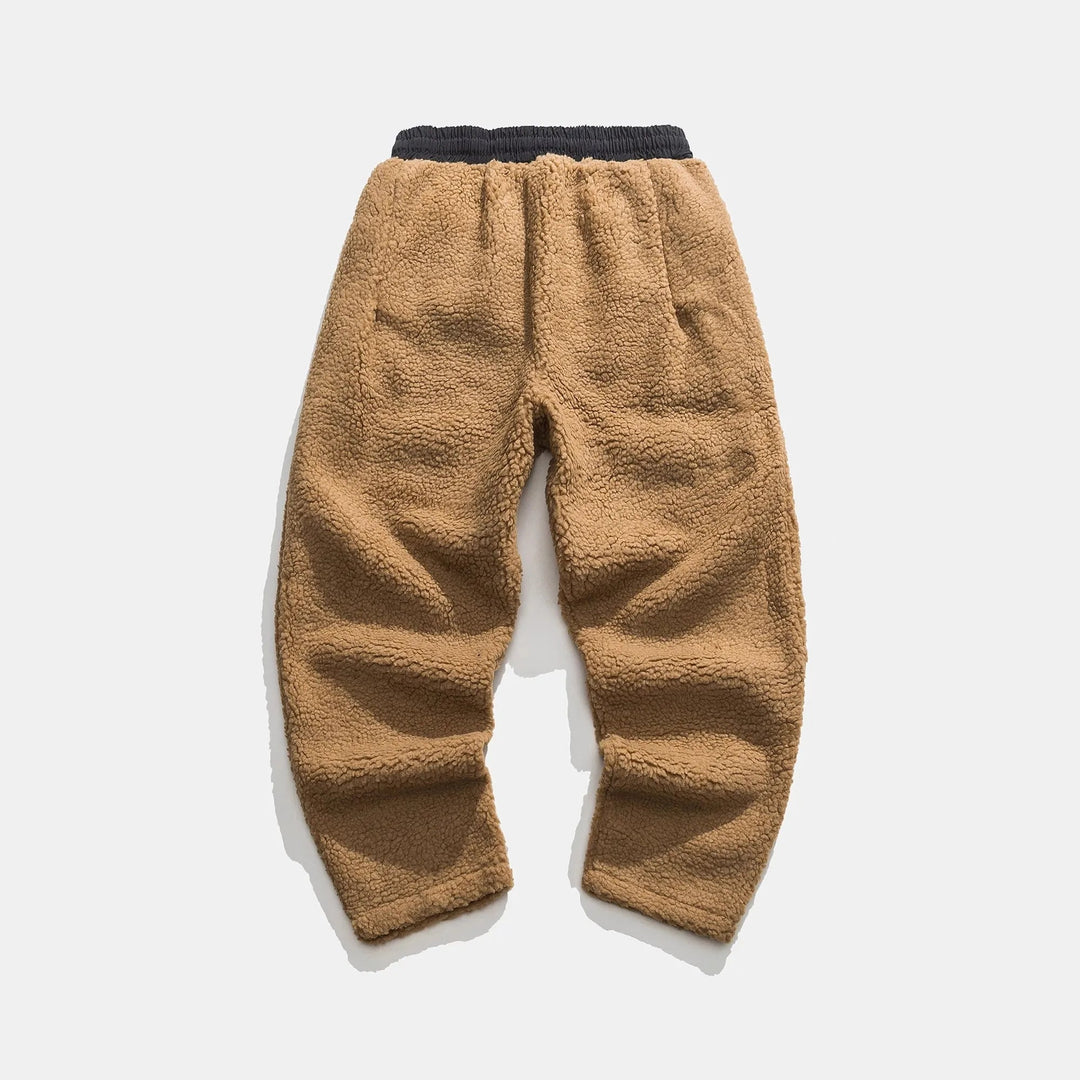 Warm men's sherpa fleece joggers, essential winter apparel for cozy comfort and style.