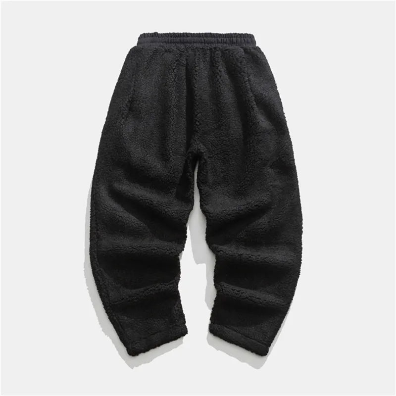 Man wearing soft Summit Sherpa Jogger Pants, showcasing relaxed fit and cozy comfort.