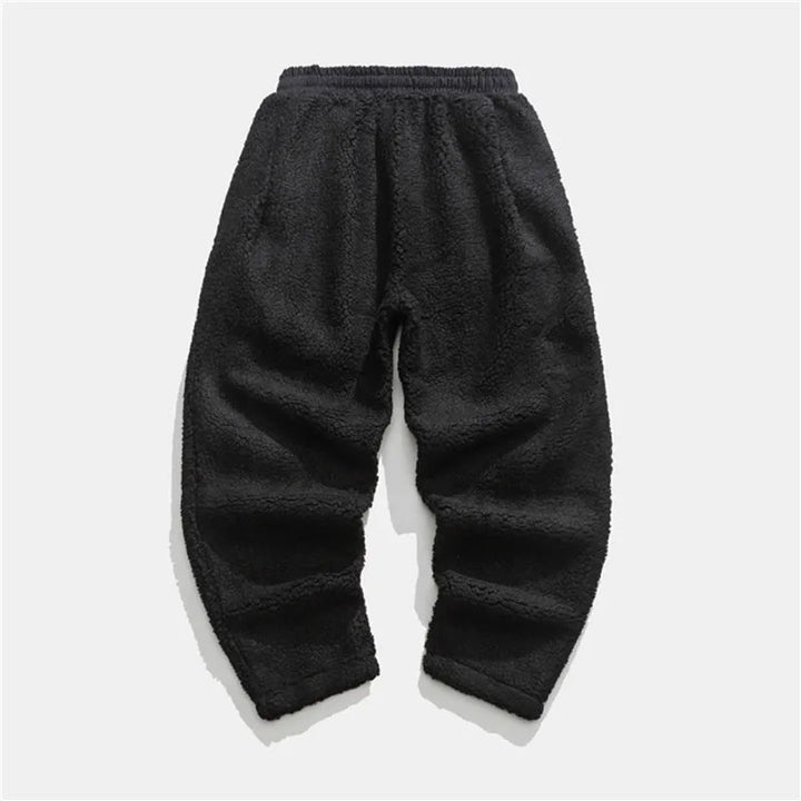Man wearing soft Summit Sherpa Jogger Pants, showcasing relaxed fit and cozy comfort.