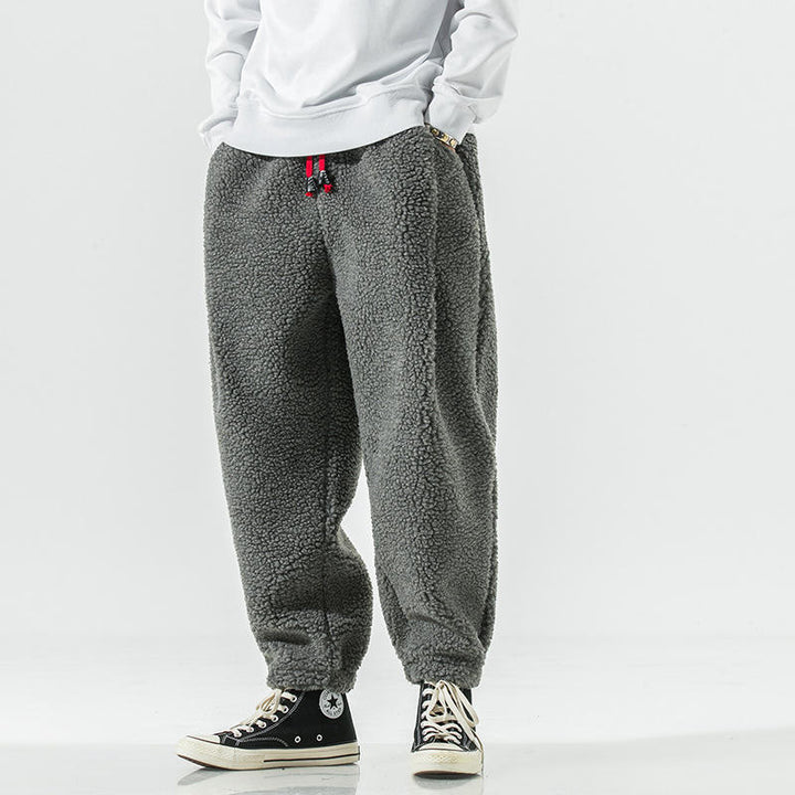 Men's cozy fleece joggers, providing plush sherpa comfort and warmth for lounge or casual.