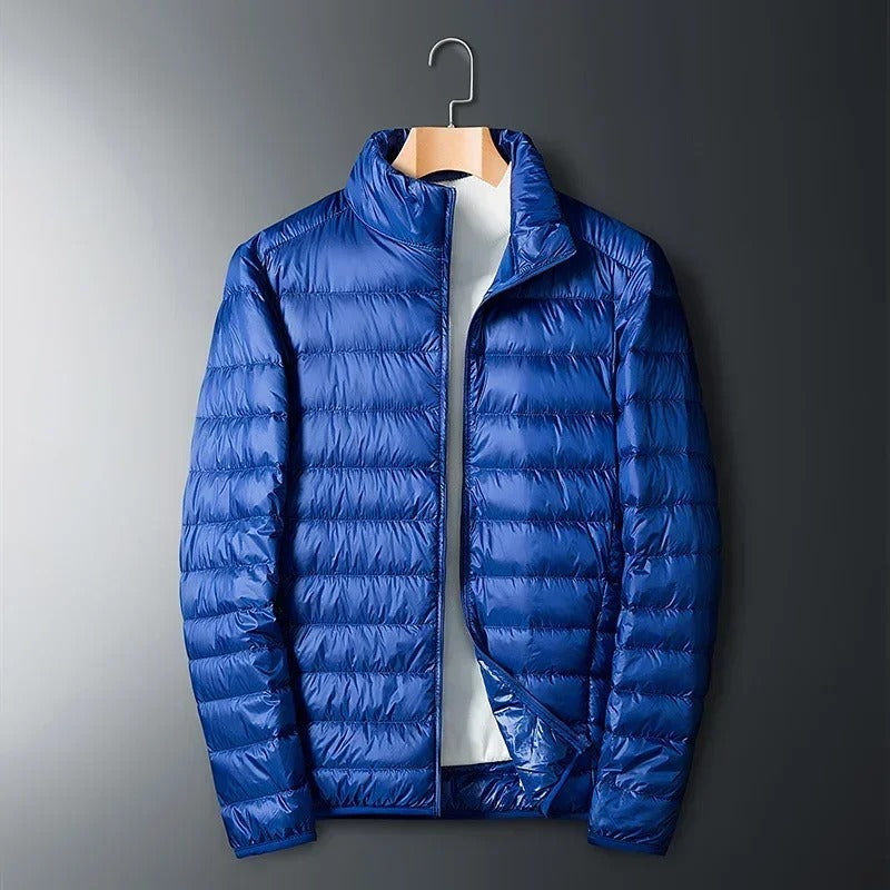 Durable navy Summit thermal jacket for men, an essential winter coat for extreme cold outdoor wear.