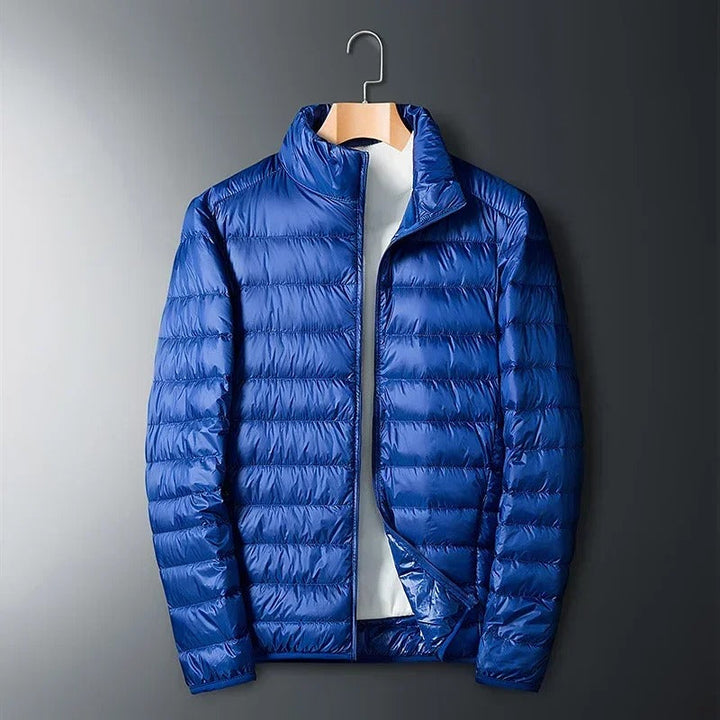 Durable navy Summit thermal jacket for men, an essential winter coat for extreme cold outdoor wear.