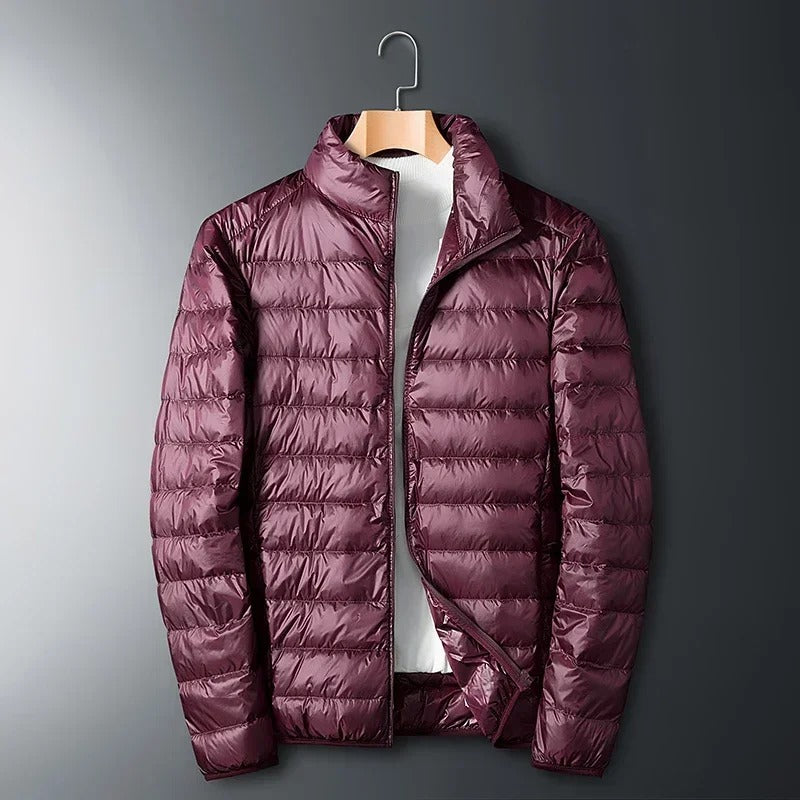 Gray men's Summit jacket, a premium thermal winter coat designed for extreme cold weather apparel.