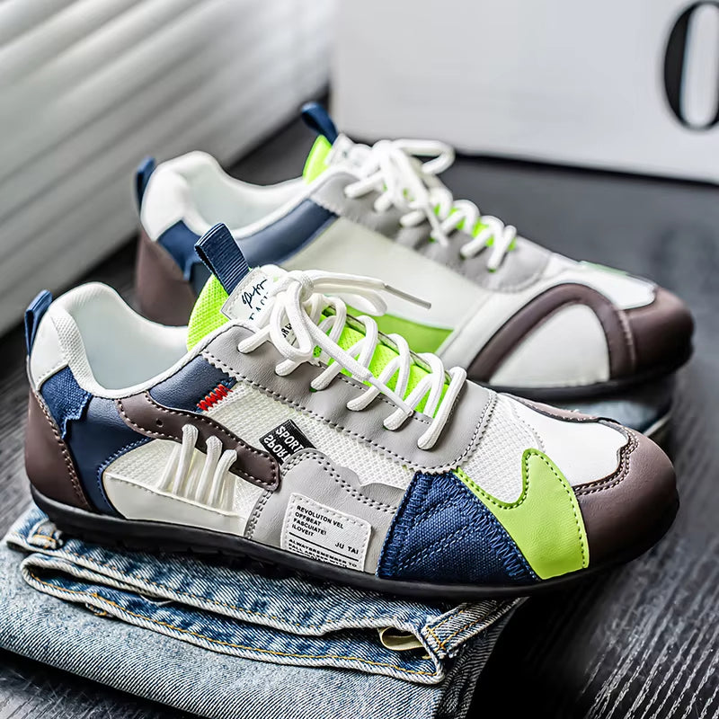 Front view of Men's Surge multi-panel trainers, vibrant athletic sneakers with comfortable toe box for men's fashion.