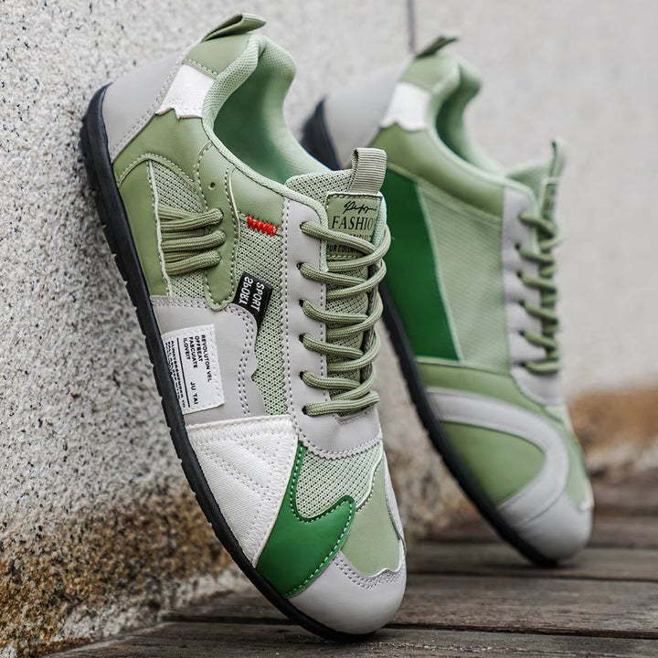 Pair of vibrant Men's Surge multi-panel athletic trainers, comfortable cushioned sneakers for men's casual footwear.
