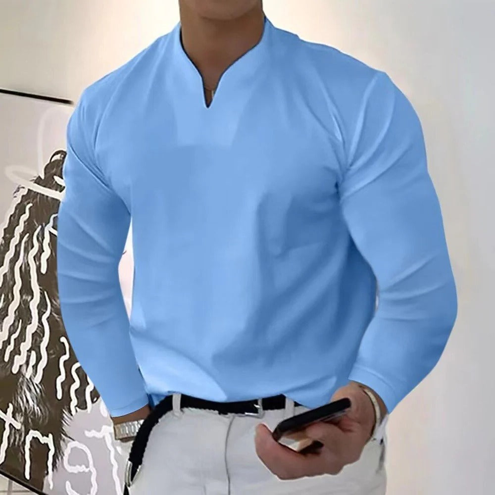 Man confidently wearing a comfortable sweat-proof V-neck shirt, looking sharp.