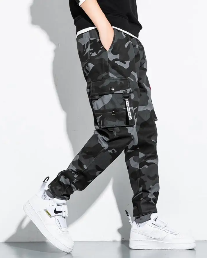 Utility-focused men's tactical camo pants. Cargo pockets, tapered fit, durable design.