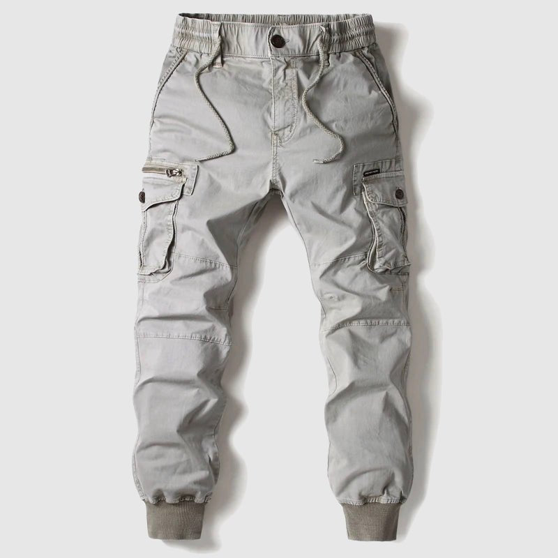 Rugged men's tactical pants with ample cargo pockets, ideal for outdoor activities & practical use.
