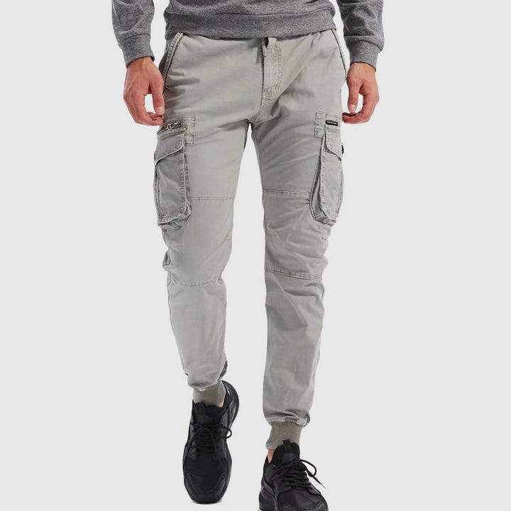 Comfortable men's jogger pants, versatile for athletic or casual wear, featuring a relaxed fit & durable fabric.