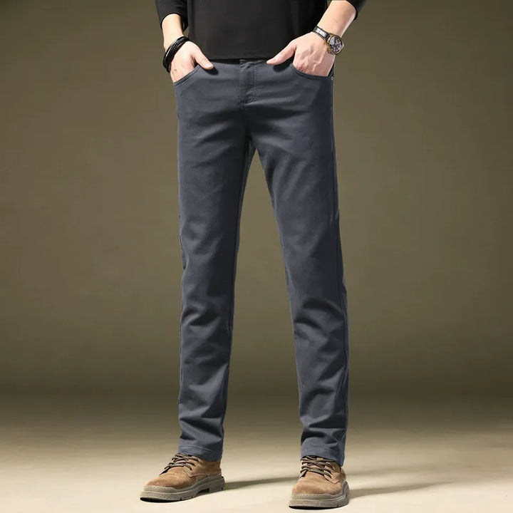 Men's tailored cotton trousers, comfortable & modern for smart casual or elegant menswear.