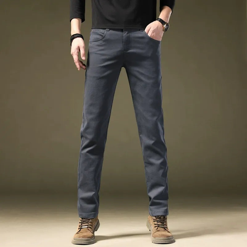Dark gray men's tailored cotton trousers, refined & comfortable for modern smart casual or dress.