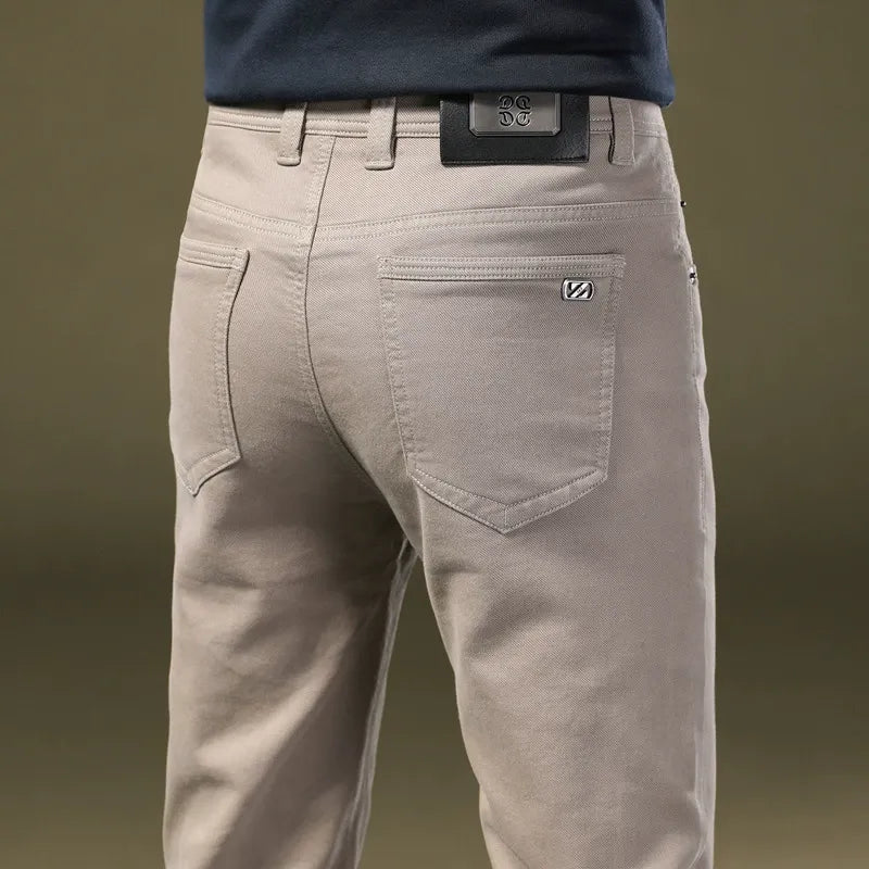 Full-length men's tailored dark gray cotton trousers, comfortable & elegant for modern menswear.