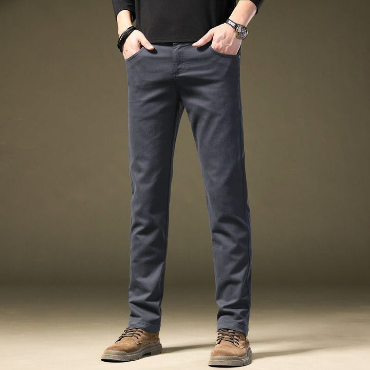 Close-up of comfortable tailored cotton trousers for men, showcasing refined fabric texture.