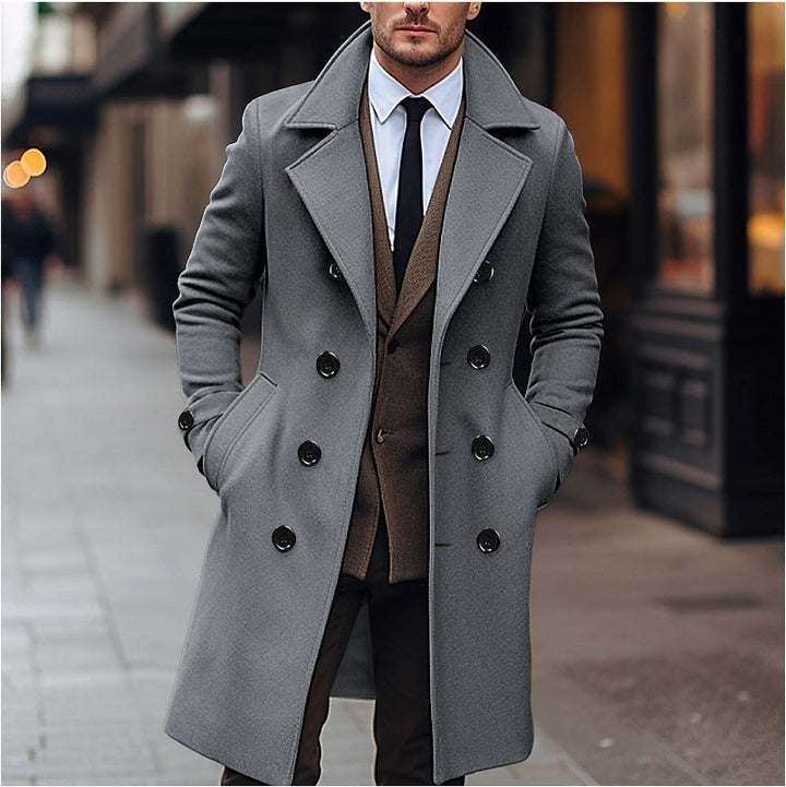 Men's tailored double-breasted long overcoat in dark color for elegant winter formal and smart casual outerwear.
