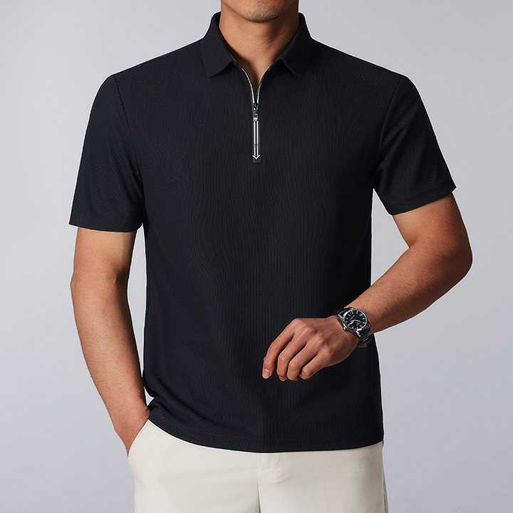 Men's tailored fit quarter-zip polo shirt in breathable cotton blend, perfect for casual or business casual wear.