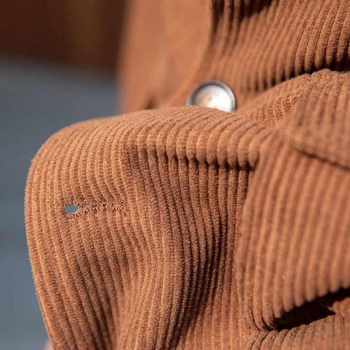 Stylish men's fashion herringbone blazer, a sophisticated choice with elegant gold buttons for any event.