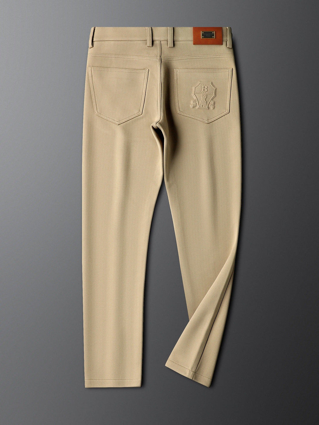Elegant men's tailored trousers with a distinctive herringbone weave.