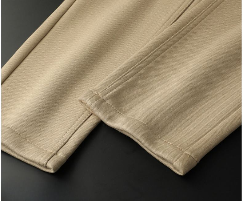 Tailored men's herringbone trousers, merging classic pattern with modern style.