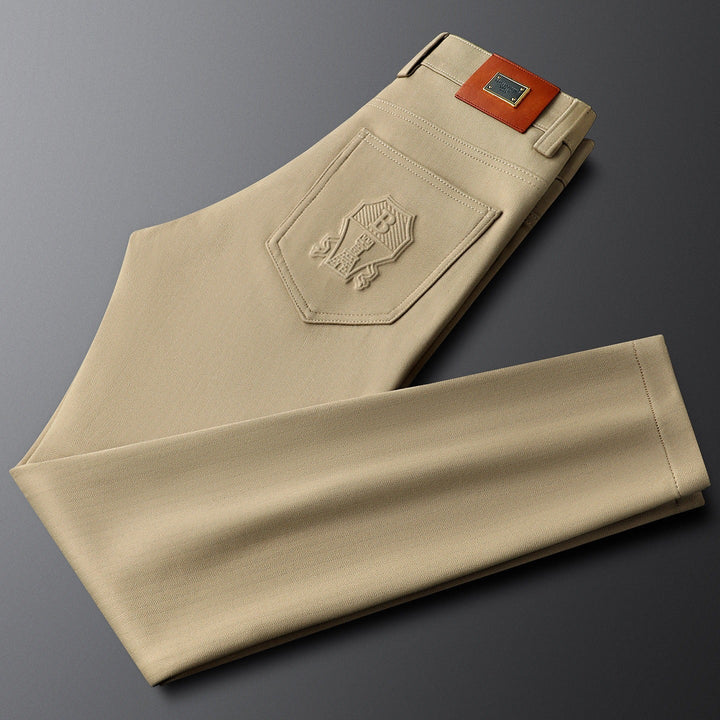 Designer men's tailored herringbone trousers, perfect for business attire.