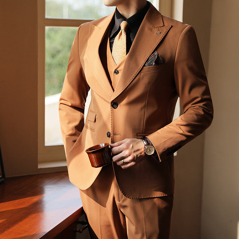 Men's tailored three-piece suit, perfect for weddings & formal events. Slim fit design for a modern look.