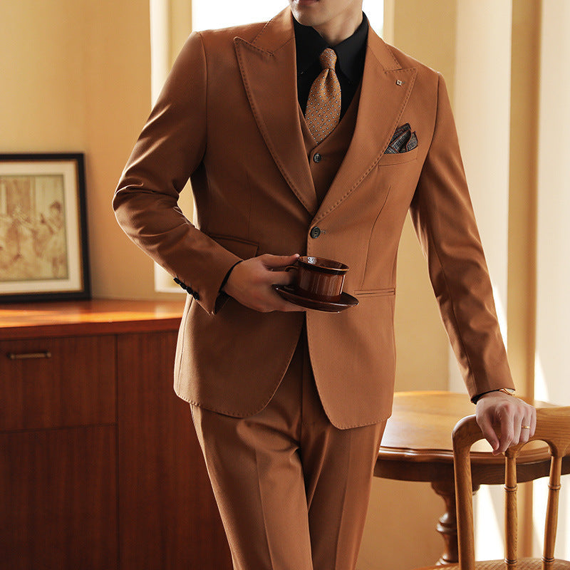Classic three-piece tailored suit for men, designed for a sharp look at any formal occasion or wedding.