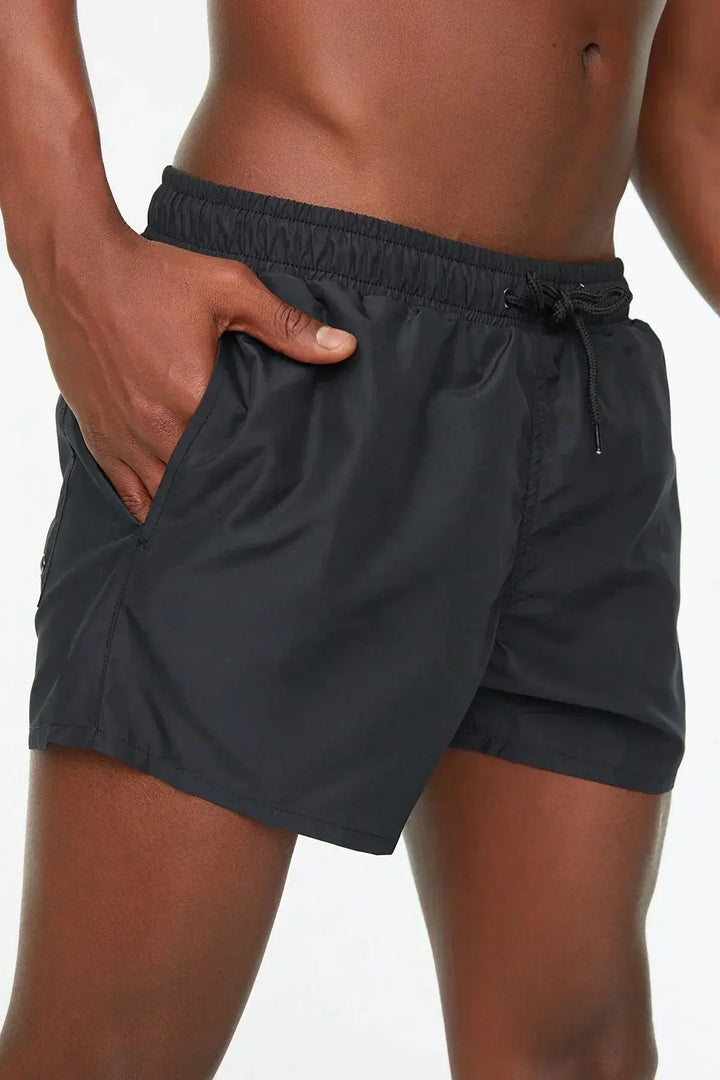 Tan men's tan-through swim shorts, opaque & quick-dry for ultimate sunbathing and comfortable summer beachwear.