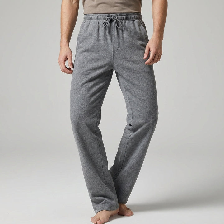 Dark blue tapered casual jogger pants for men, ideal for athletic wear and everyday comfort, side view.