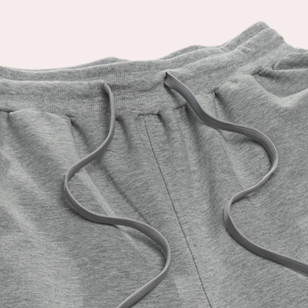 Close-up of the fabric texture on men's cotton tapered casual jogger pants, soft and breathable.