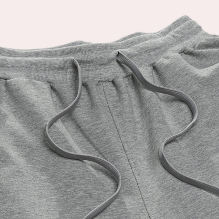 Close-up of the fabric texture on men's cotton tapered casual jogger pants, soft and breathable.