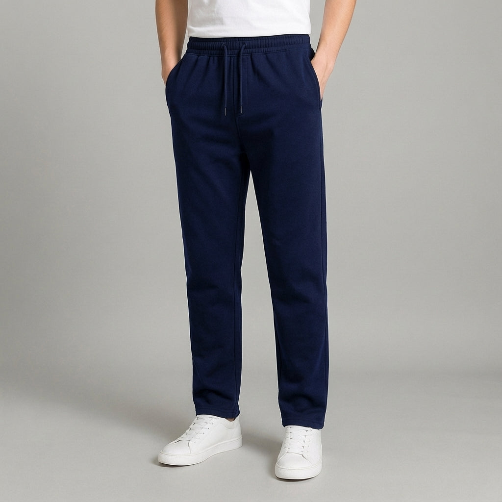 Back view of men's tapered jogger pants in a relaxed fit, highlighting pocket detail and athletic cut.