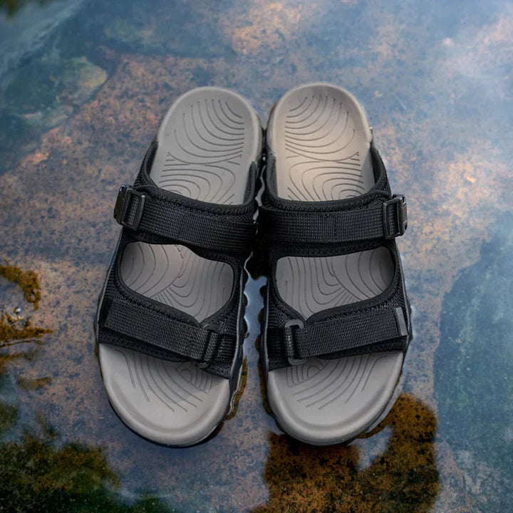 Rugged Men's TerraGlide outdoor sandals for multi-terrain adventures, perfect for exploring nature.