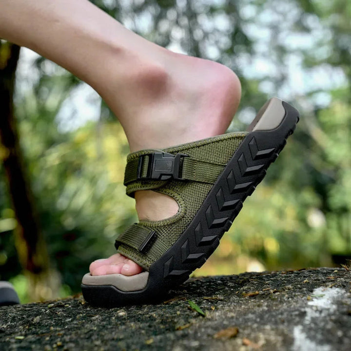 Pair of green TerraGlide men's walking sandals, offering ultimate comfort and grip for adventures.