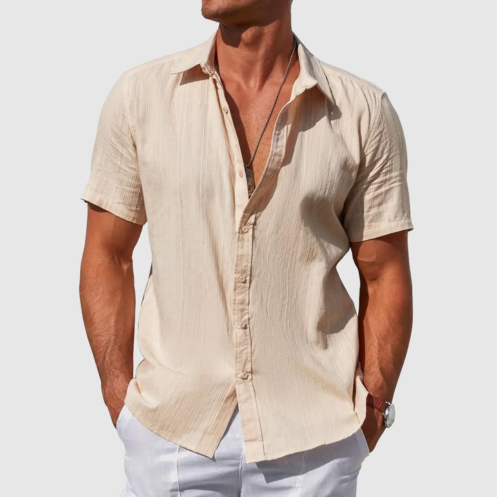 Stylish men's casual textured button-front short sleeve top, perfect for versatile summer outfits.